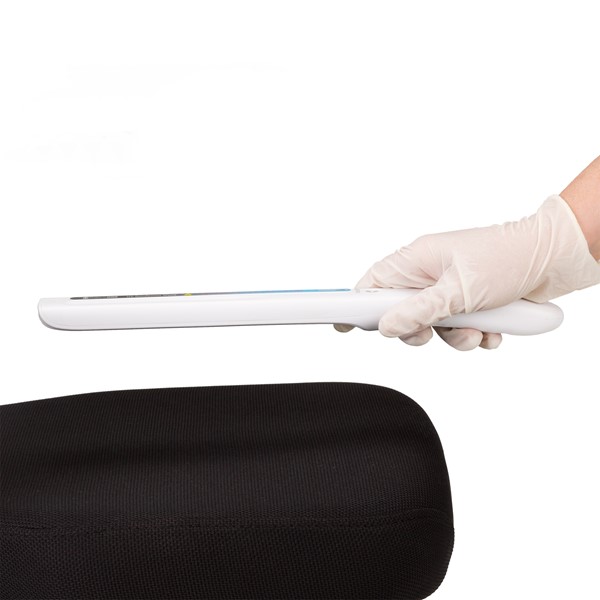 Handheld UV Wand disinfecting a bus seat